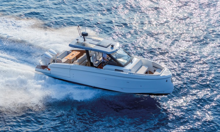 Beneteau Gran Turismo 35 with twin Mercury outboards performing at high speed.