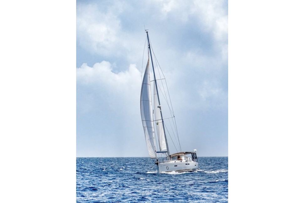 jeanneau sun odyssey 469 05 sailing coastal mountains